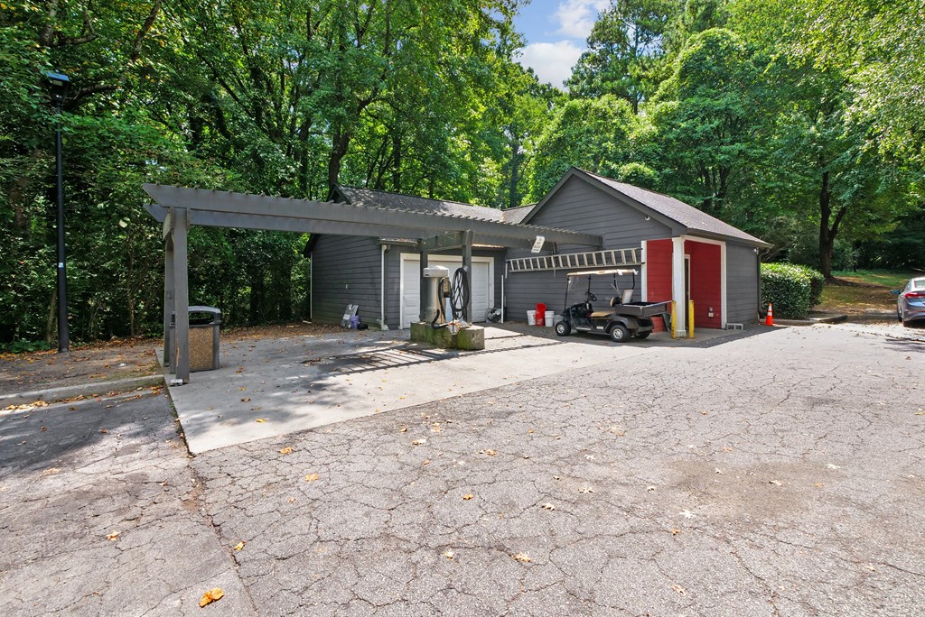 Car Care Center A house with a garage and a car parked in front at Elme Druid Hills, Atlanta, Georgia